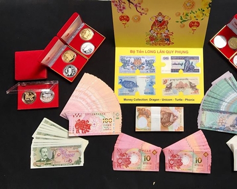 Tiền lì xì in linh vật con heo tết Kỷ Hợi được nhiều người lùng mua Tien li xi in linh vat con heo tet Ky Hoi duoc nhieu nguoi lung mua